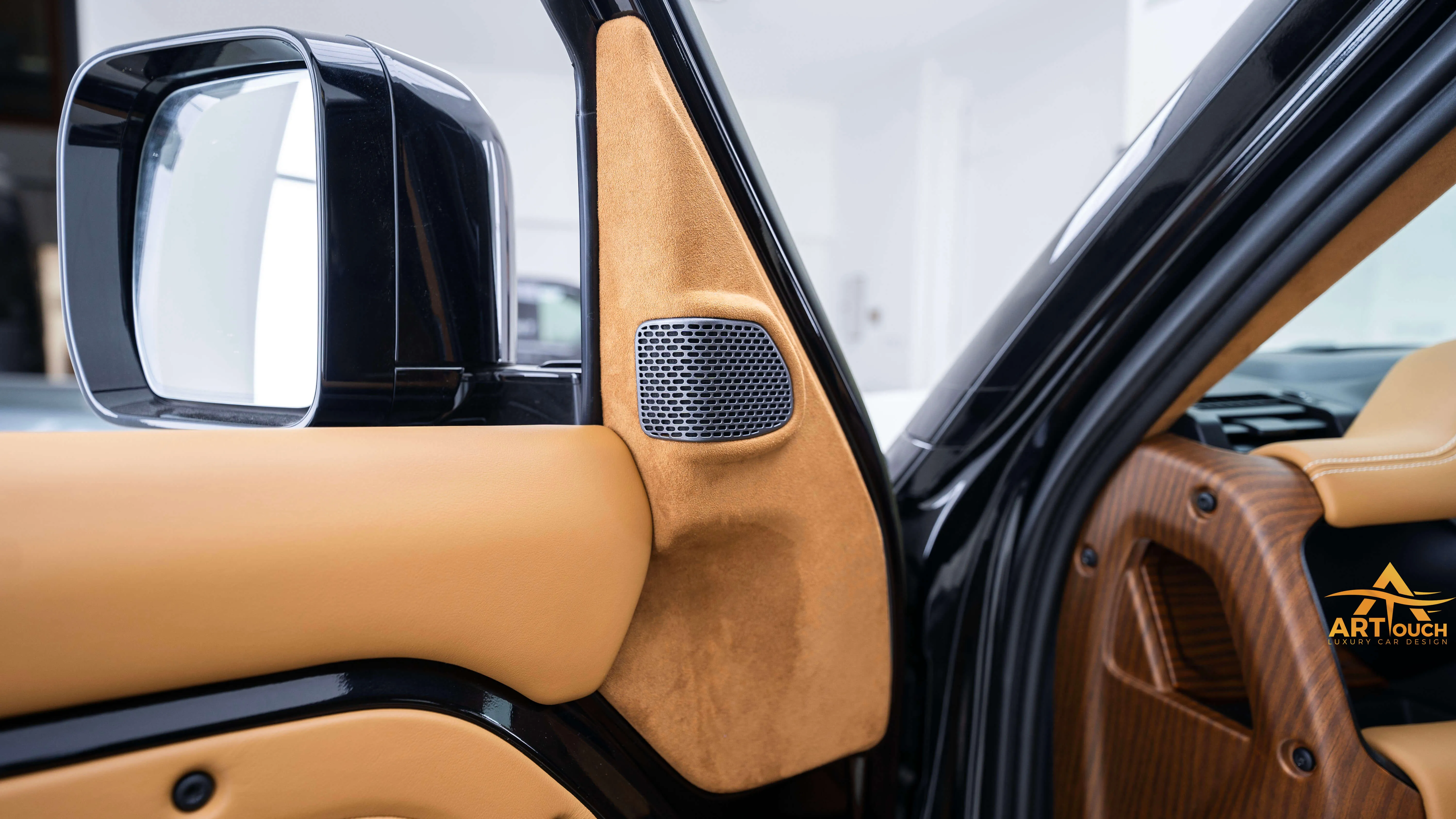 Bespoke Defender leather cabin. Premium Alcantara steering, custom gear knobs, and door panels crafted for a supreme luxury feel