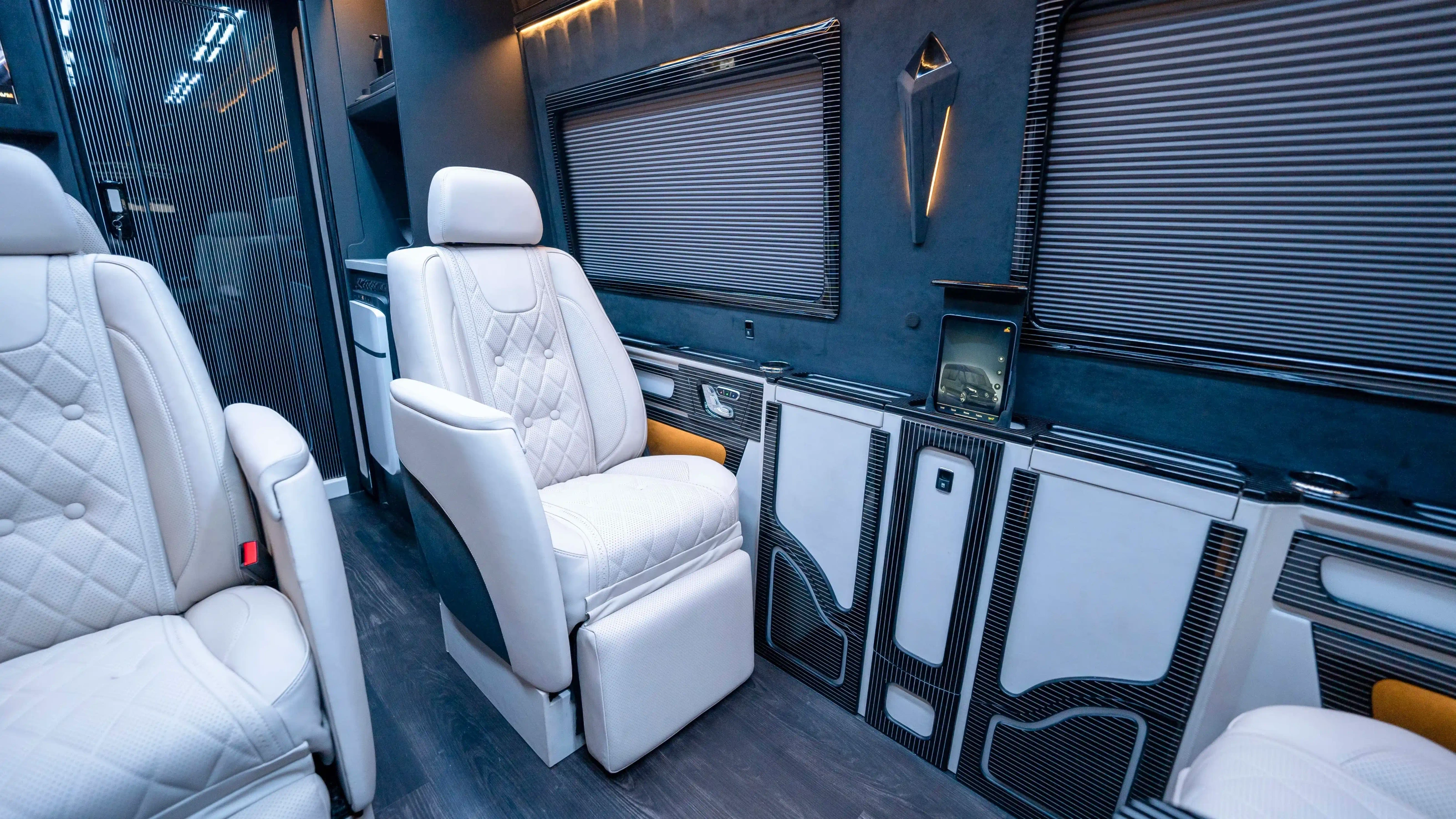 Bespoke Mercedes Sprinter VIP Interior in Dubai featuring White Leather, Black Alcantara, Executive VIP Seating and Luxury Van Customization
