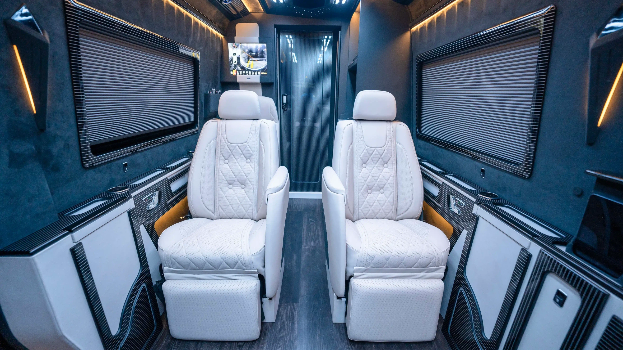 Bespoke Mercedes Sprinter VIP Interior in Dubai featuring White Leather, Black Alcantara, Executive VIP Seating and Luxury Van Customization