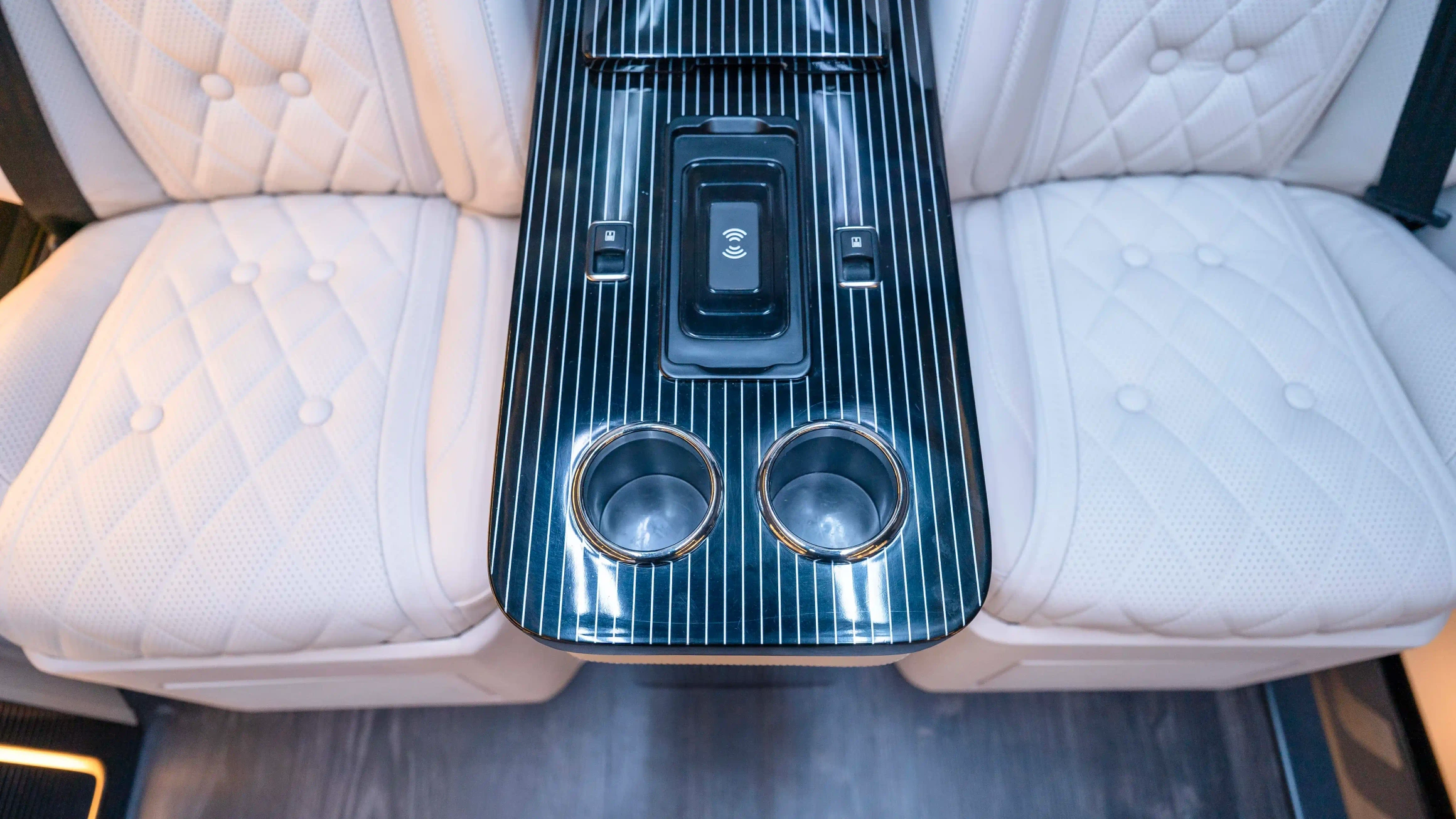Bespoke Mercedes Sprinter VIP Interior in Dubai featuring White Leather, Black Alcantara, Executive VIP Seating and Luxury Van Customization