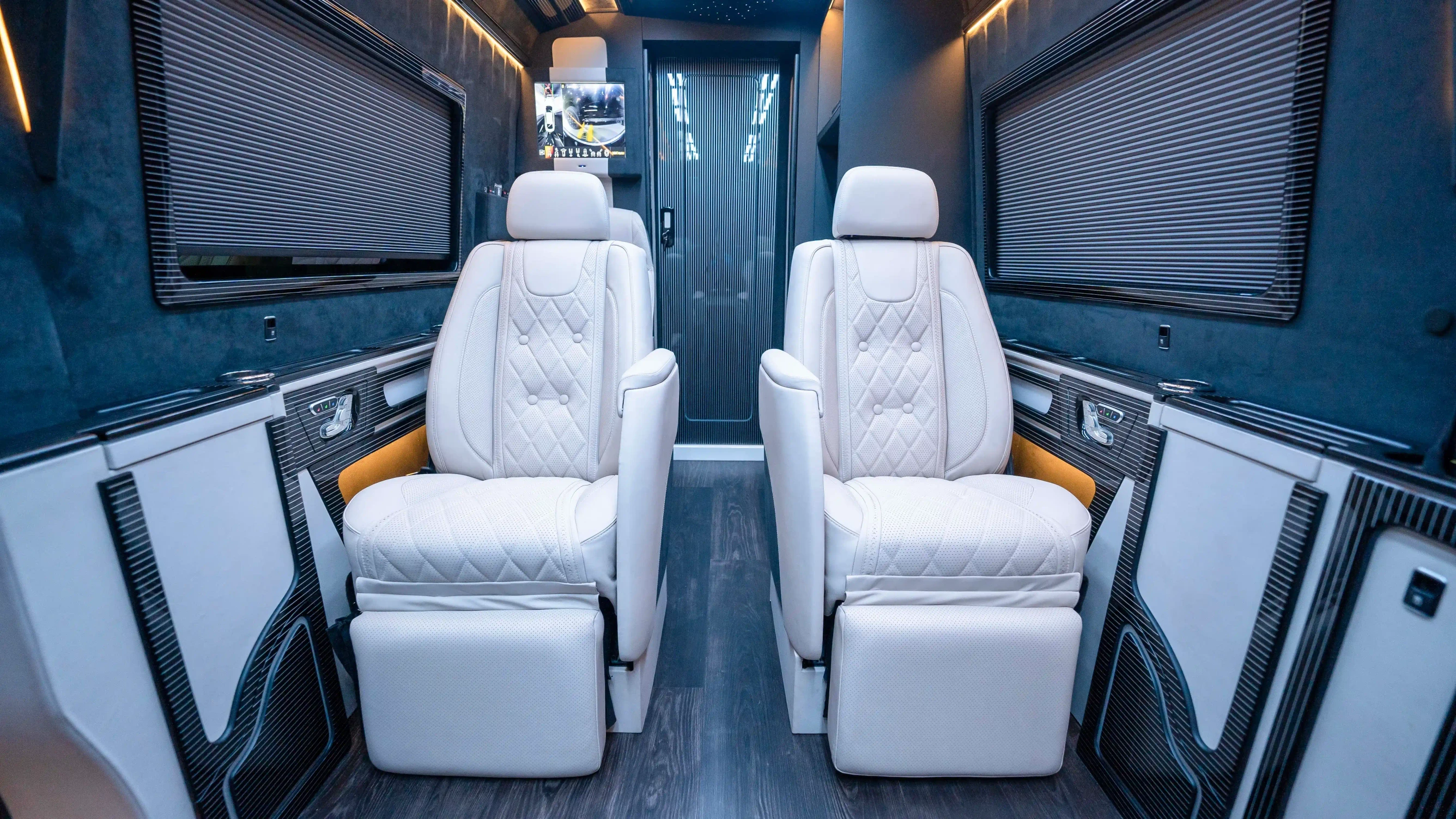 Bespoke Mercedes Sprinter VIP Interior in Dubai featuring White Leather, Black Alcantara, Executive VIP Seating and Luxury Van Customization